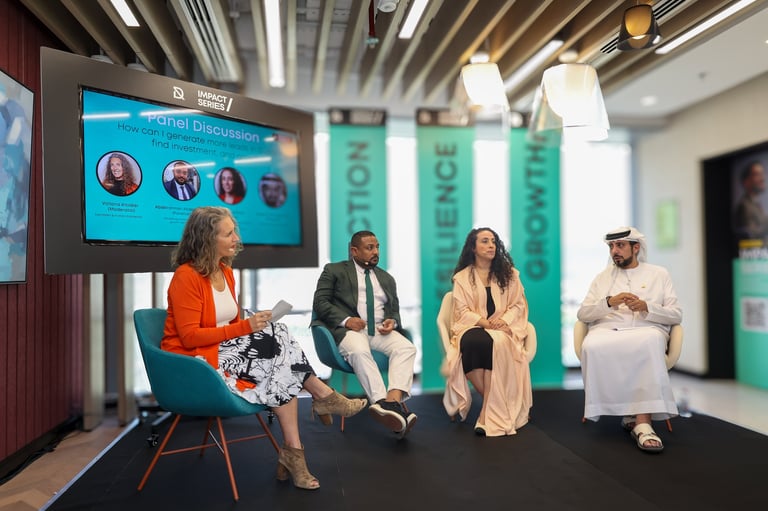 Dr. Sultan Alshaali leading panel discussion with professionals on stage